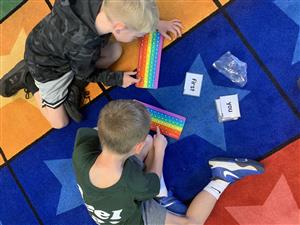 Students practicing their keyboarding on the POP-its.